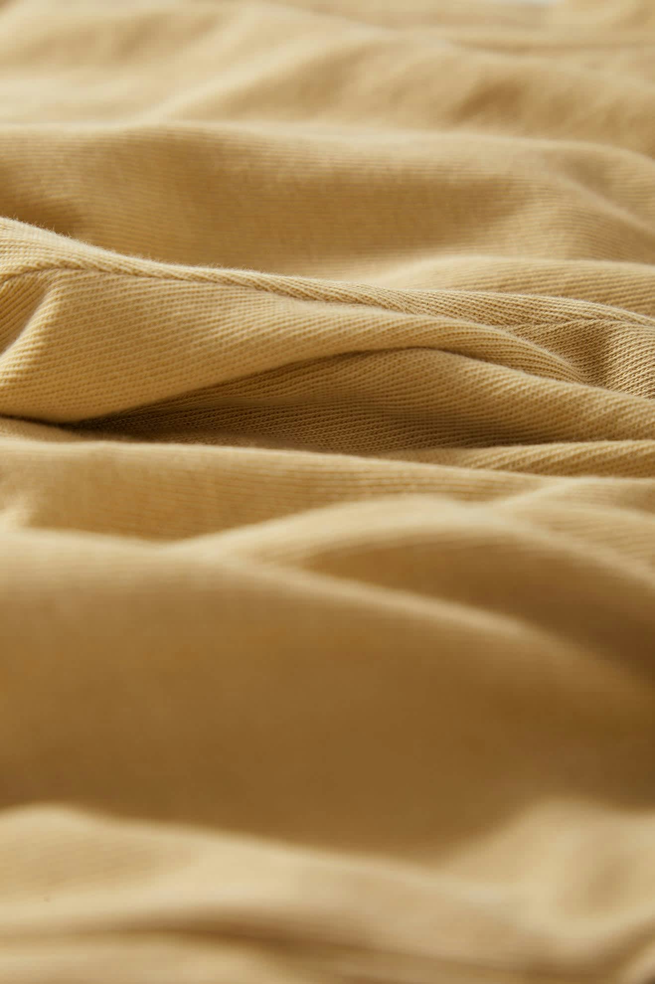 Women's Carefree Organic Garment Dyed Lounge Short in the color Pale Khaki - Additional Laydown image