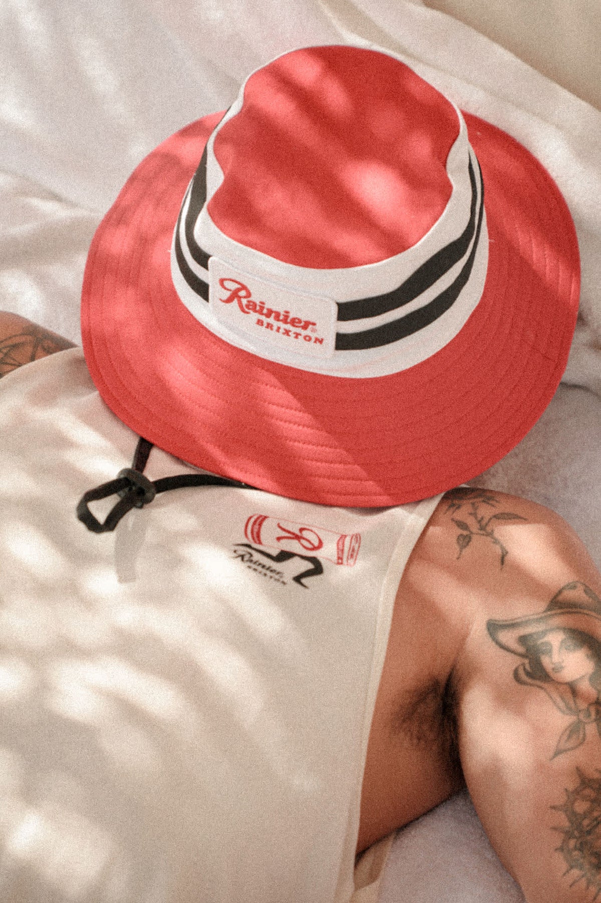 Unisex Rainier X Brixton Boonie in the color Natural/Red - Men's Lifestyle 2.0