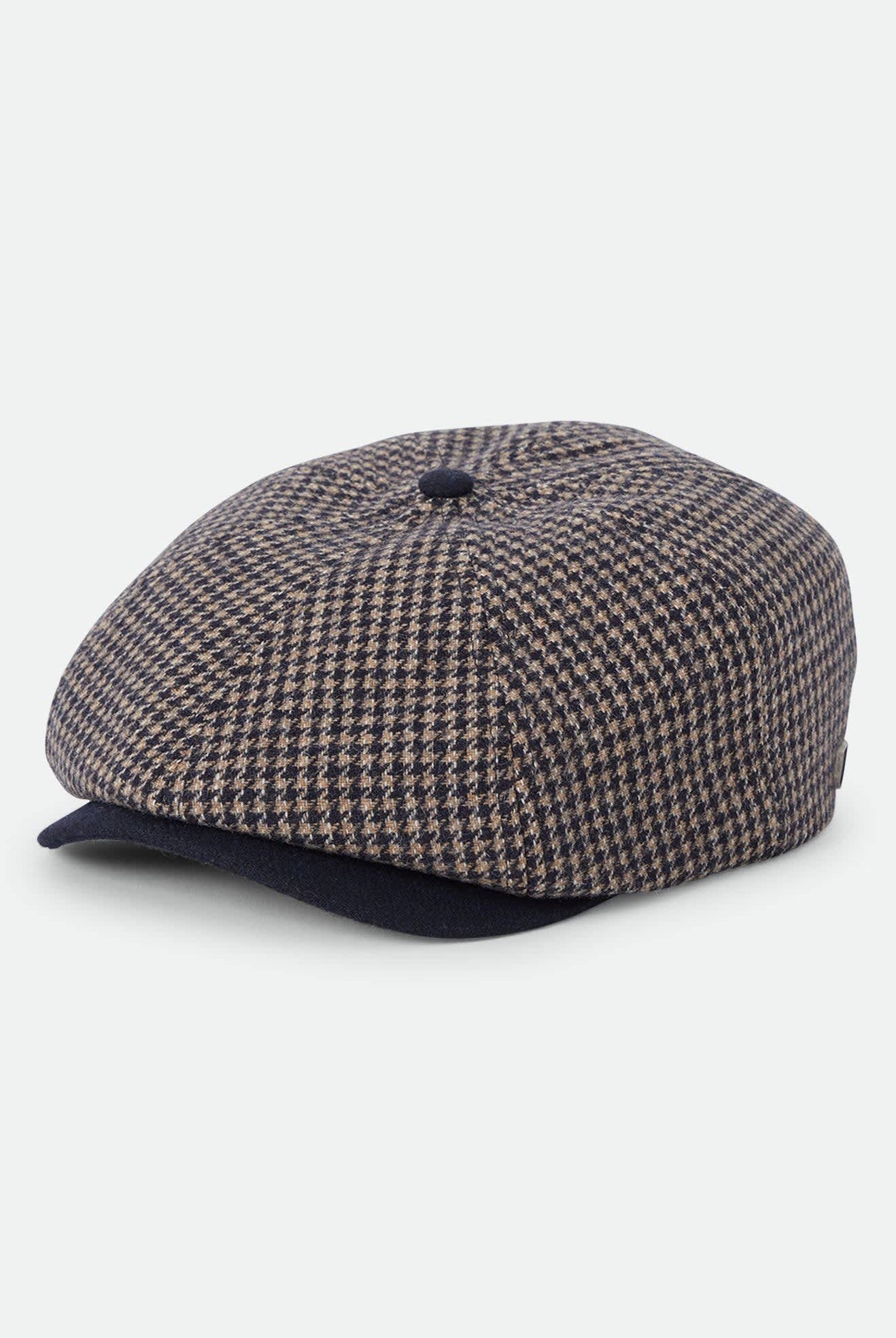 Unisex Brood Newsboy Cap in the color Navy/Sand Houndstooth - Front Product Laydown Image