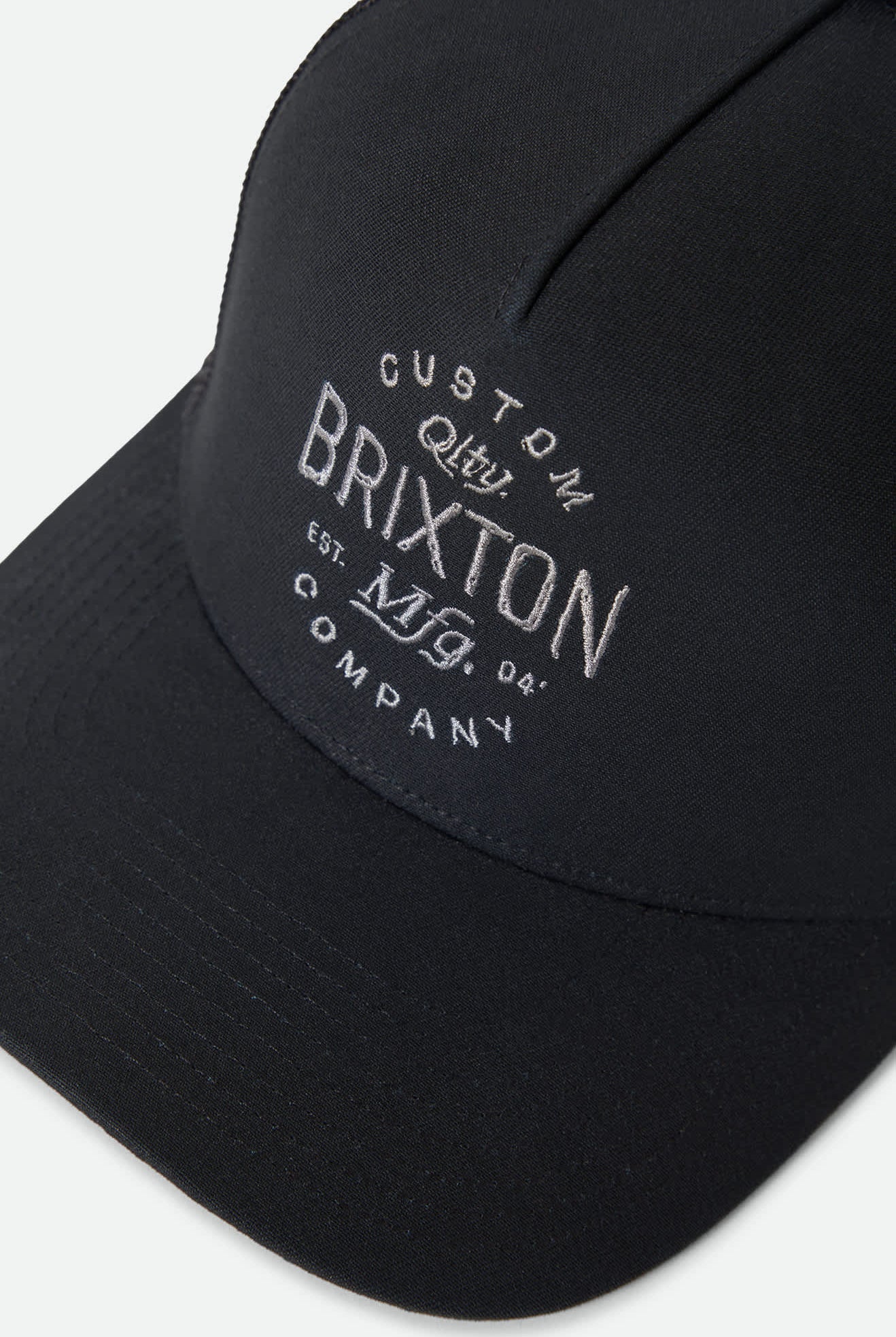 Unisex Fremont Netplus Trucker Hat in the color Black/Black - Additional Laydown image