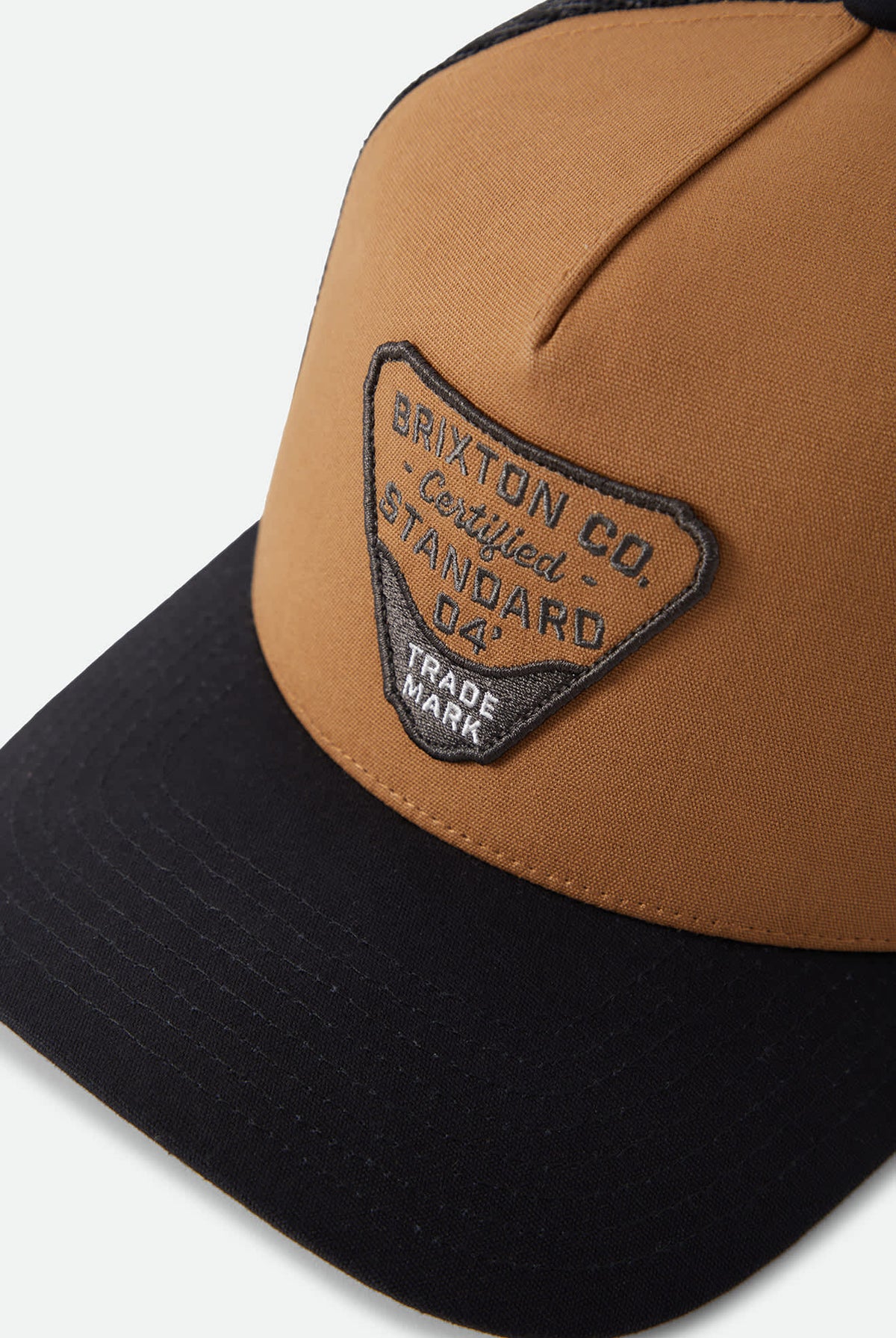 Unisex Blighton Trucker Hat in the color Dusted Ochre/Black - Additional Laydown image