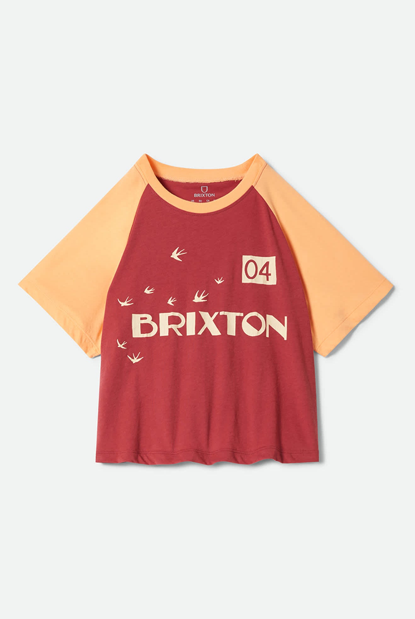 Women's Swallow Sky Cropped Raglan in the color Robust Red/Peach Cobbler - Front Product Laydown Image