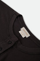 Women's Carefree Organic Garment Dye Cropped Henley in the color Black - Additional Laydown image