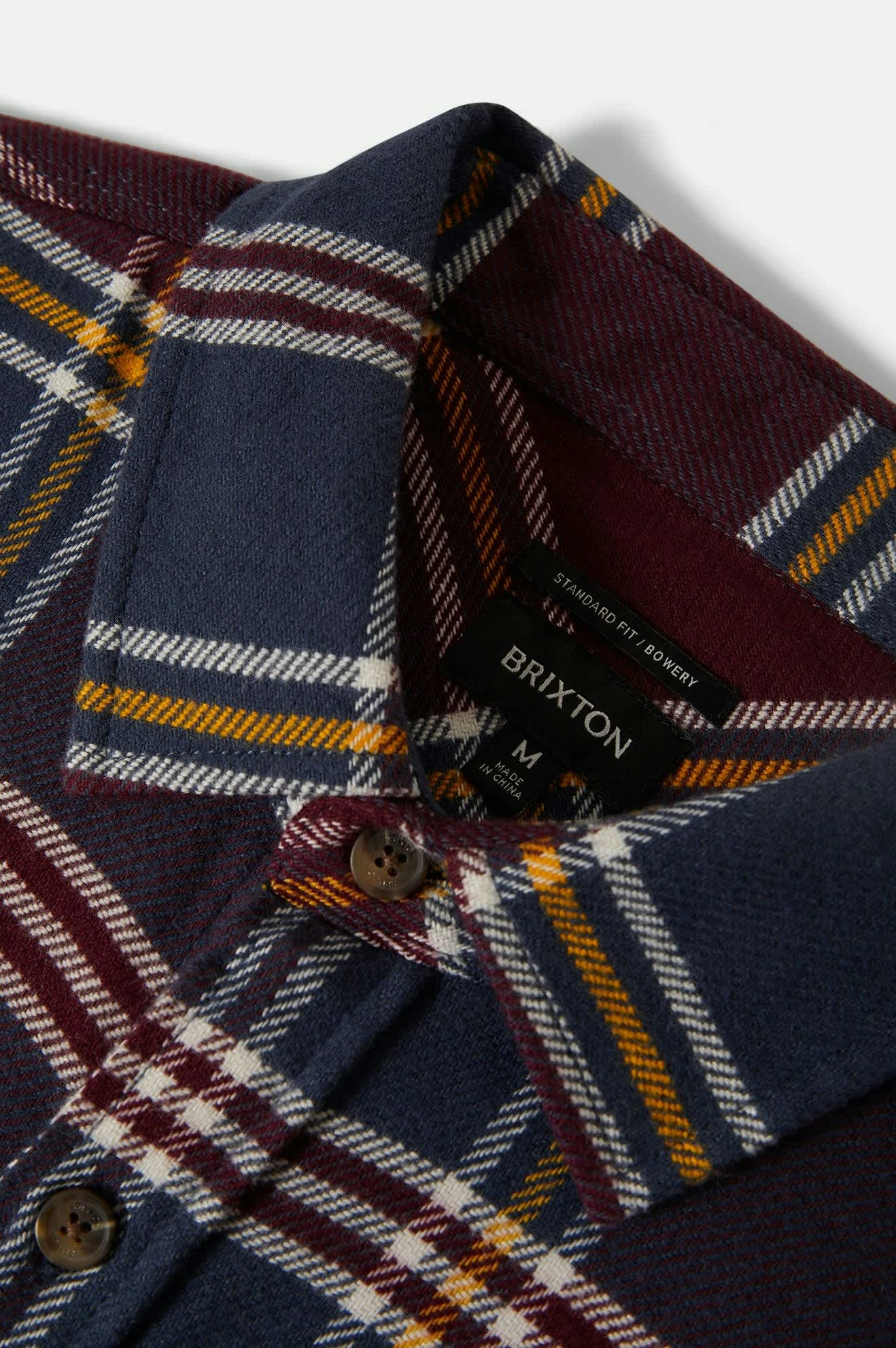 Men's Bowery L/S Flannel in the color Mood Indigo/Port/Saffron - Additional Laydown image