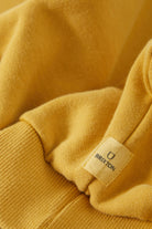 Men's Brixton Baseline Crew Fleece in the color Dusted Ochre Vintage Wash - Additional Laydown image
