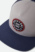 Unisex Oath Trucker Hat in the color Sustained Grey/Washed Navy - Additional Laydown image