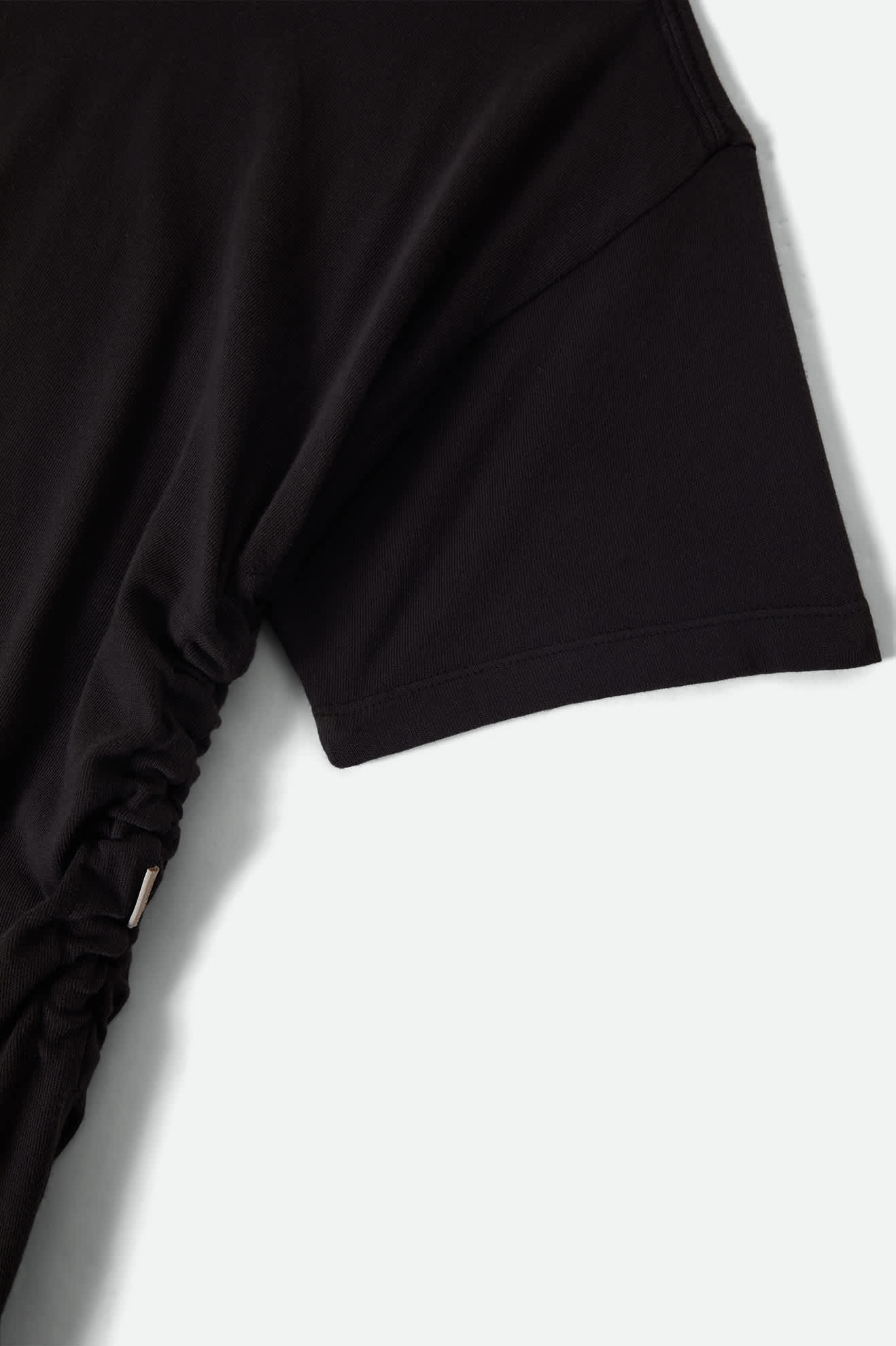 Women's Carefree Organic Garment Dye Cinch T-Shirt in the color Black - Additional Laydown image