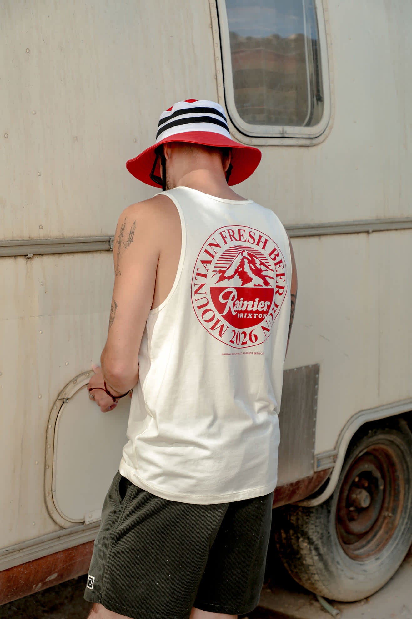 Men's Rainier Beer Run Tank in the color Natural - Men's Lifestyle 2.0