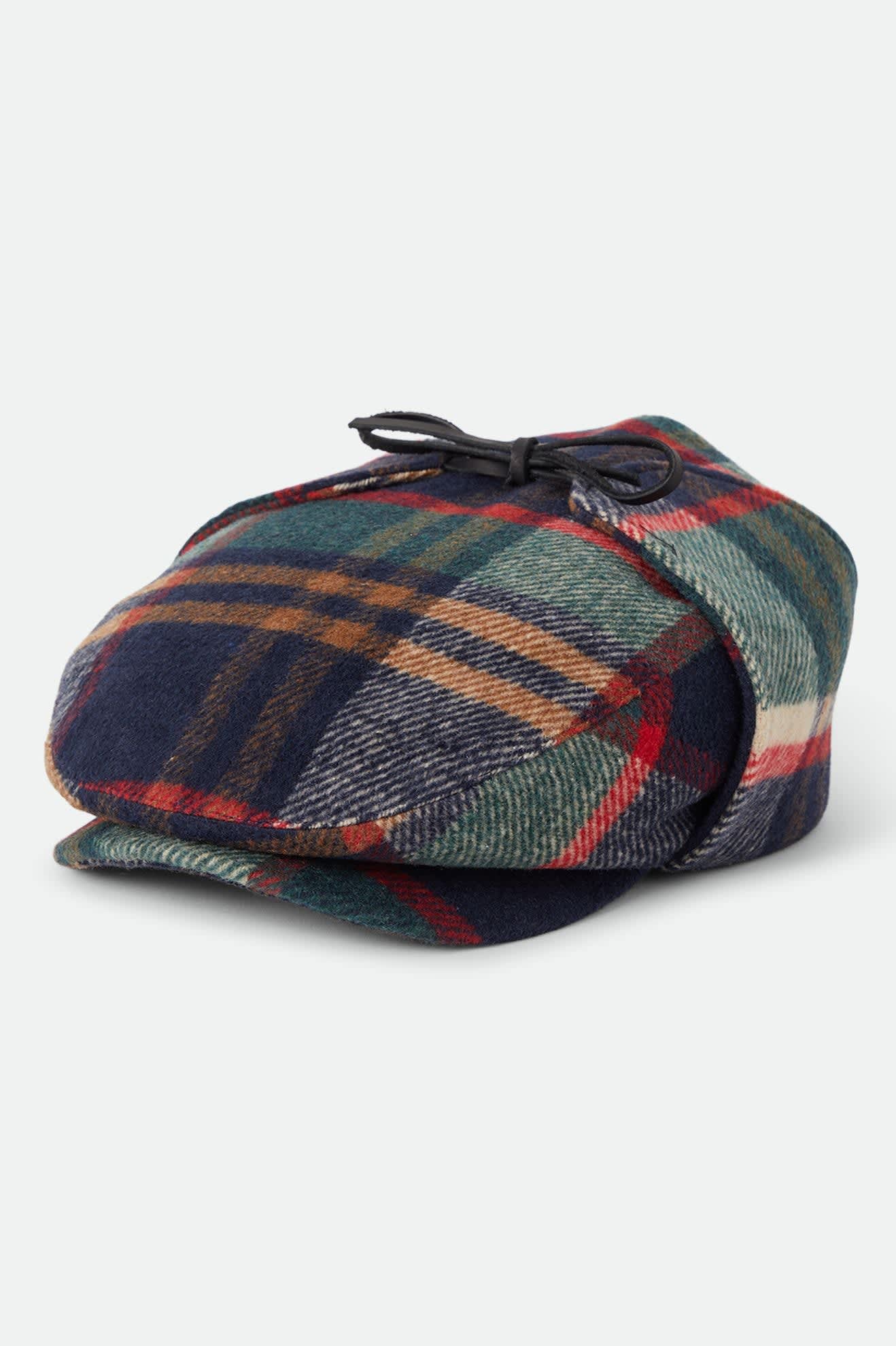 Unisex Barrel Earflap Snap Cap in the color Navy/Green/Red/Cream - Front Product Laydown Image