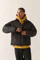Men's Journey Puffer Jacket in the color Black - Men's Front View