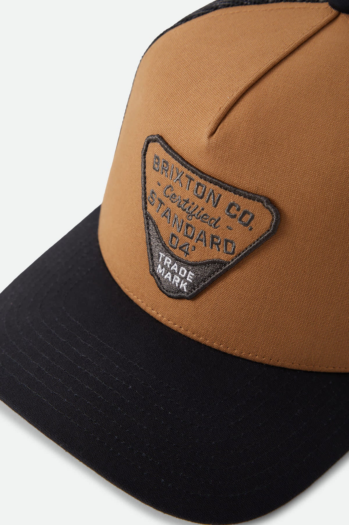 Unisex Blighton Trucker Hat in the color Dusted Ochre/Black - Additional Laydown image