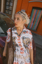 Women's The Cinch Button Down Short Sleeve Dress in the color Lost In Reality Print - Men's Lifestyle image