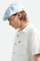 Unisex Hooligan Flat Cap in the color Light Blue/White - Men's Side View