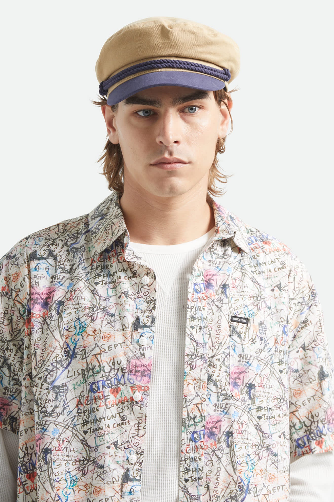 Unisex Fiddler Fisherman Cap in the color Sand/Washed Navy - Men's Front View